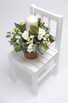 White lisianthus, rose, freesia and chrysanthemum candle decoration