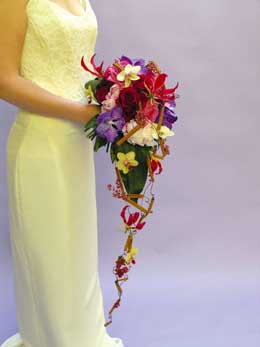 Gloriosa, vanda, and dendrobium orchid  shower bouquet with cinnamon sticks and Hans' trademark wire work 