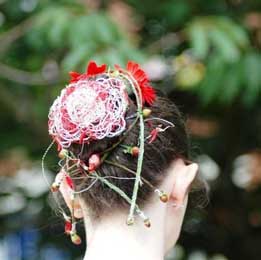 Gerbera, hypericum and wire hairpiece