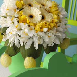 Gerbera, tulips, white iris, aspidistra and asclepias seed pods